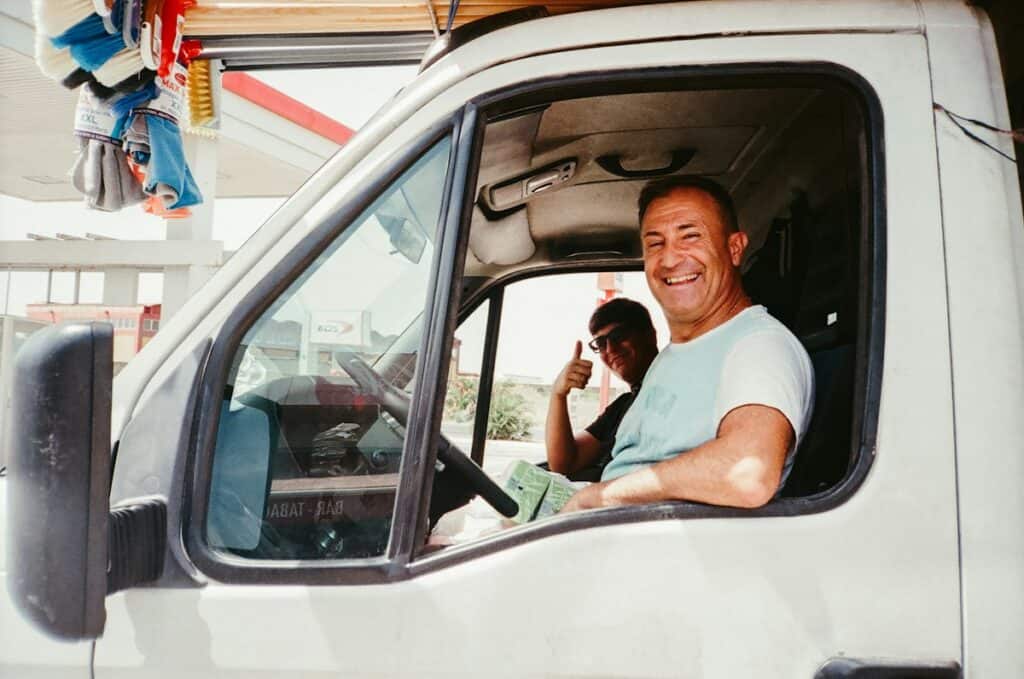 Smiling van driver giving a thumbs up from the cab