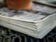 Close-up of a thick stack of folded newspapers