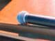 Microphone lying on a wooden desk