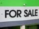 Green and white For Sale sign