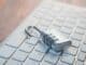 Combination padlock resting on a white computer keyboard