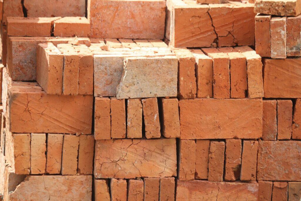 Stacks of red clay bricks
