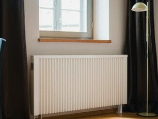 White radiator under a window in a living room