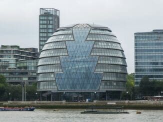 Glass-fronted London City Hall building beside the River Thames